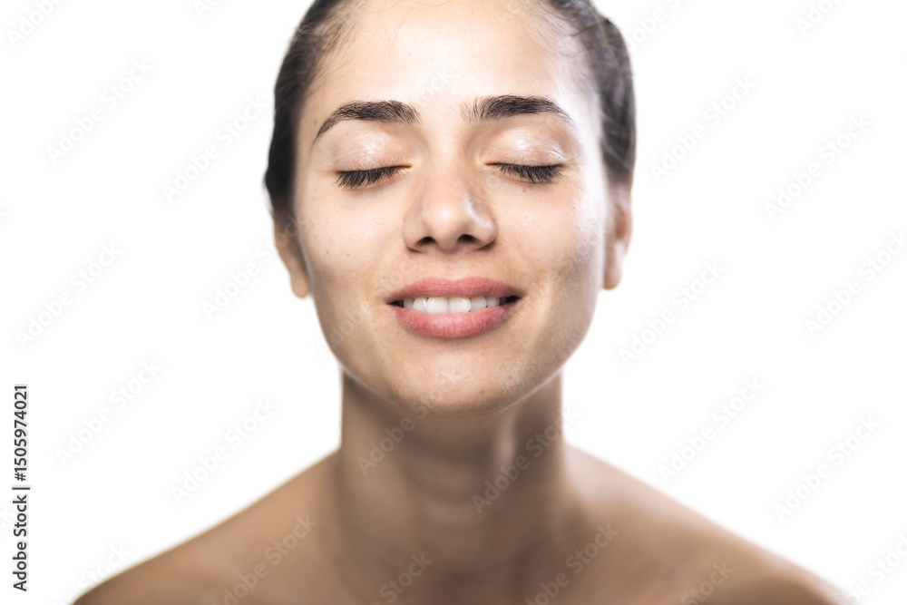 Portrait of a young woman with closed eyes and a serene expression in studio Portrait of a young woman with closed eyes and a serene expression in studio