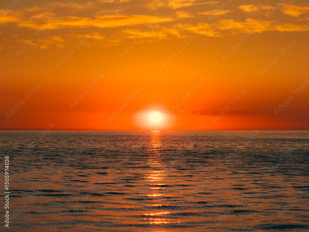 Fototapeta premium Orange Cast Of The Sunlight Over The Ocean 