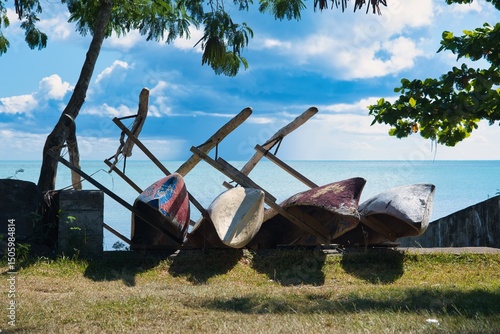 Traditional wooden boats lined up on a sandy beach in Samoa, showcasing Polynesian culture, island heritage, coastal fishing life, tropical travel destination and authentic Pacific craftsmanship.