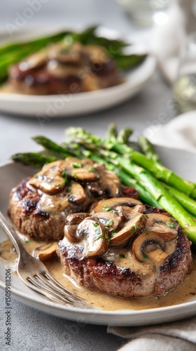 Savory Beef With Mushroom Sauce and Fresh Asparagus on a Dining Table.