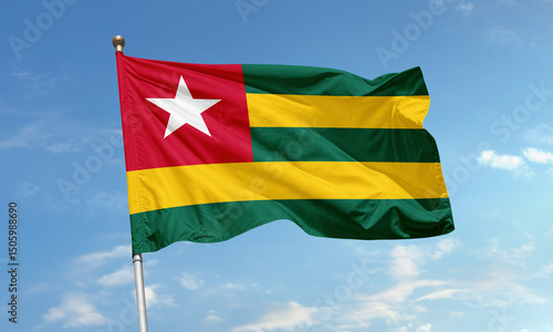 Photography Togo national flag waving in blue sky