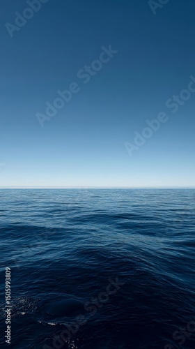 Tranquil Ocean View Under a Clear Blue Sky at Midday.