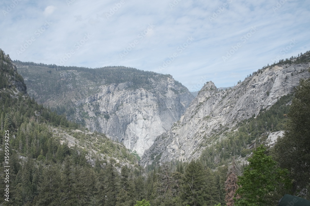 Fototapeta premium Yosemite National Park in California’s Sierra Nevada mountains luscious greenery scenery waterfall with rainbow