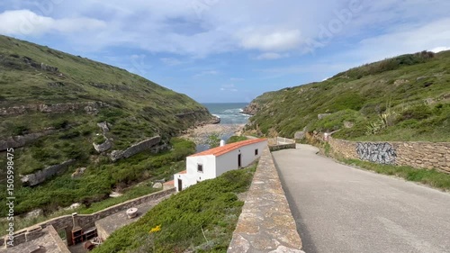 house on a wild beach in the Portuguese coastline. Samarra Beach near Sintra, Portugal