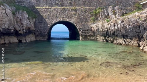Fortress wall with a tunnel to the sea. Peniche Fortress in Portugal