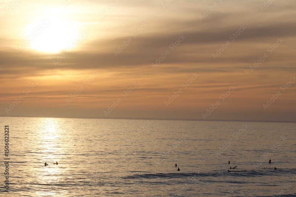 surfer silhouettes during beautiful sorbet sunset in pacific beach tourmaline san diego surfer silhouettes during beautiful sorbet sunset in pacific beach tourmaline san diego