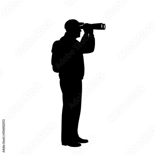 Silhouette of elderly man photographing with camera while standing  