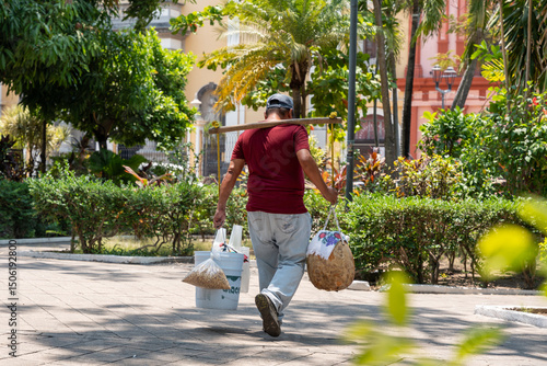 Vendor of traditional coconut palm drink called tuba in downtown Colima, Colima, Mexico.