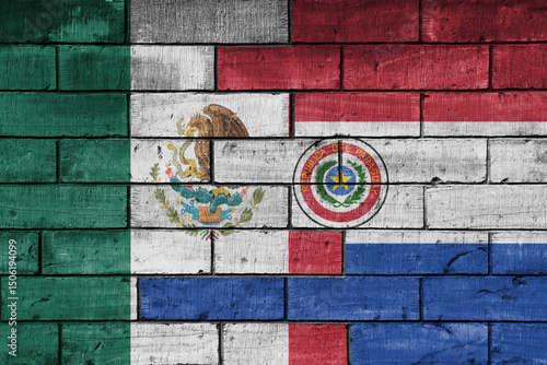 colourful painted big national flag of mexico and flag of paraguay on a massive old brick wall background. concept