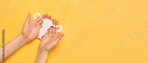 Woman with paper uterus on ...
