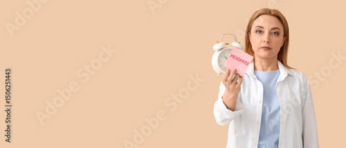 Mature woman holding paper ...