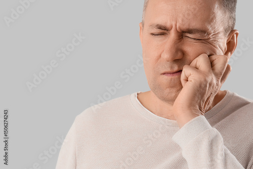 Mature man suffering from t...