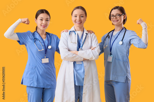 Female doctors showing musc...
