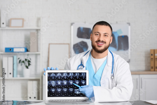 Male doctor showing MRI sca...