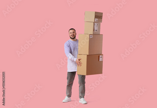 Young man with parcel boxes...