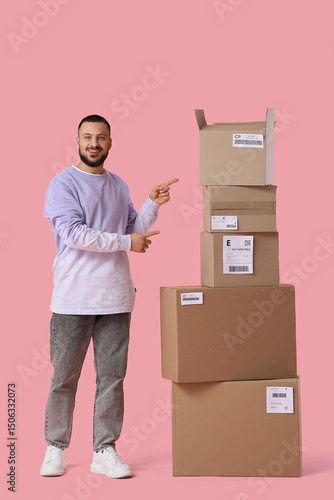 Young man pointing at parce...