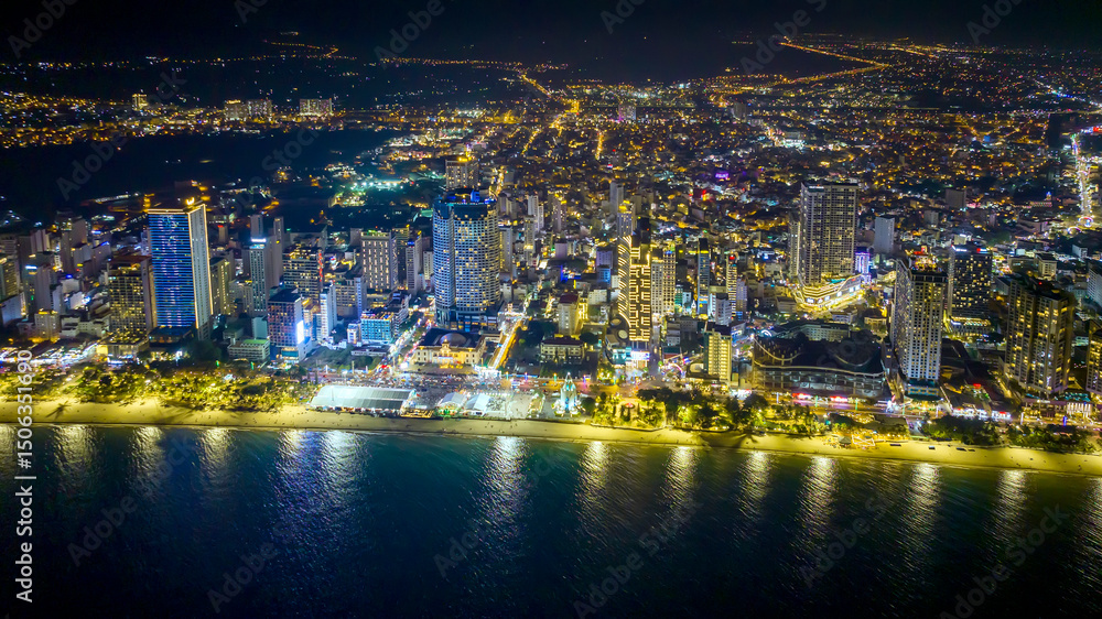 Fototapeta premium Aerial view of Nha Trang city at night. This is a famous city for cultural tourism in central Vietnam