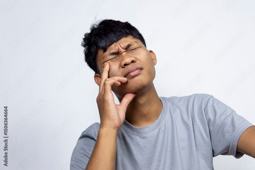 Portrait Of Depressed Young Indonesian Man, Suffering Life Problems Or Mental Breakdown, Feeling Despair, Copy Space Portrait Of Depressed Young Indonesian Man, Suffering Life Problems Or Mental Breakdown, Feeling Despair, Copy Space