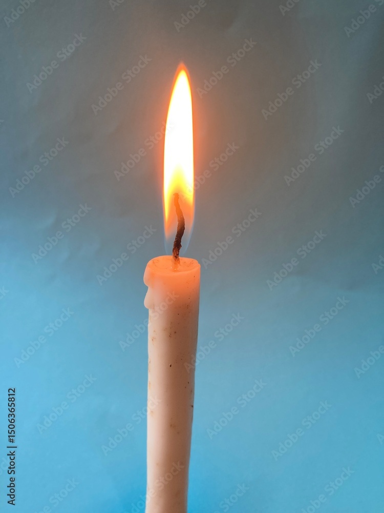 burning candle on a blue background, xmas, good Friday burning candle on a blue background, xmas, good Friday
