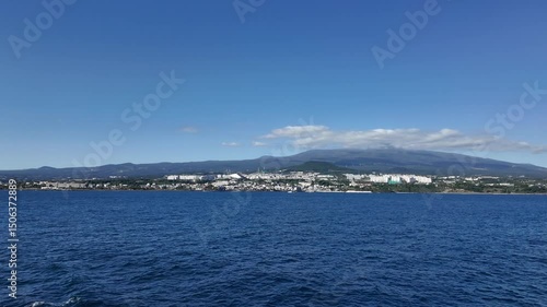 Mountain and City Skyline Seen from the Sea
