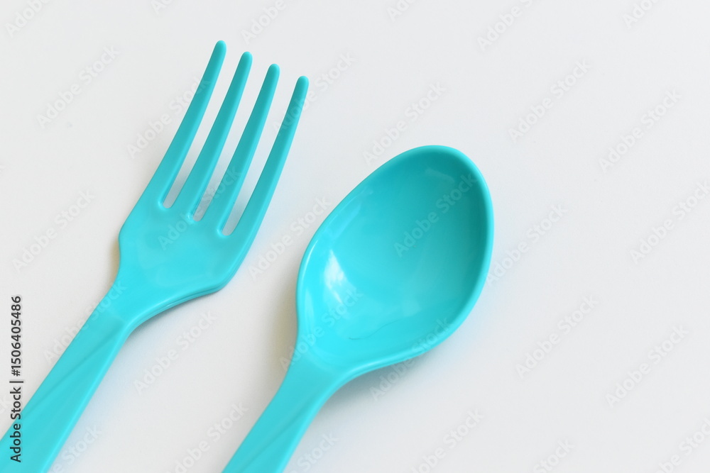 blue spoon and fork isolated on white background, plastic cutlery for picnic blue spoon and fork isolated on white background, plastic cutlery for picnic