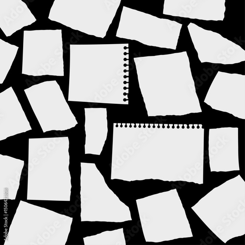 Scattered torn paper scraps and notepad sheets with spiral binding on a dark background, creating a textured and abstract pattern with copy space