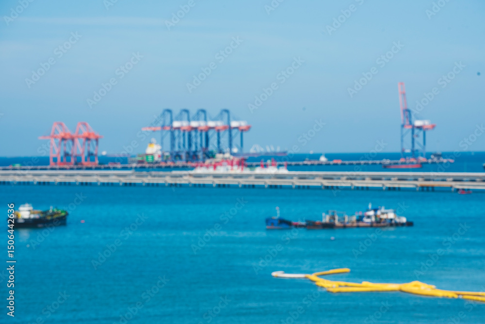 Fototapeta premium Logistic shipping quay boat Engineering crane depot at logistic export terminal control. Warehouse freight background container yard loading quayside harbor port. Logistics seascape shipping portal