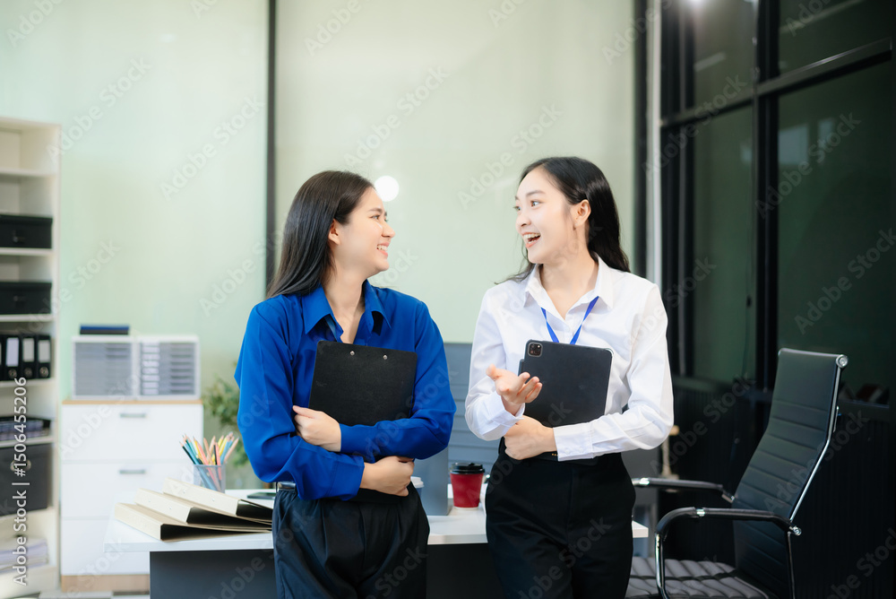Two Asian businesswoman and man discuss investment project working and planning strategy Two Asian businesswoman and man discuss investment project working and planning strategy
