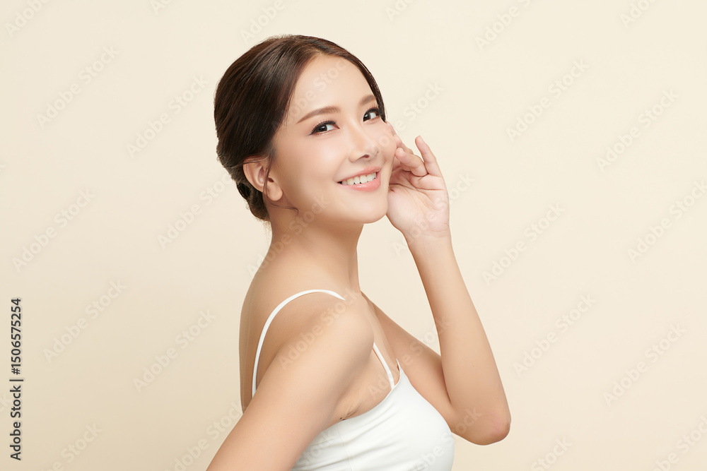 A beautiful young Asian woman with clean, fresh skin against a beige background. Skincare, facial treatment, cosmetology, beauty, and spa. An elegant portrait of an Asian woman. A beautiful young Asian woman with clean, fresh skin against a beige background. Skincare, facial treatment, cosmetology, beauty, and spa. An elegant portrait of an Asian woman.