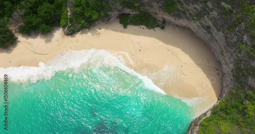 Paradise beach aerial drone view Kelingking cliff Nusa Penida sandy coast Bali