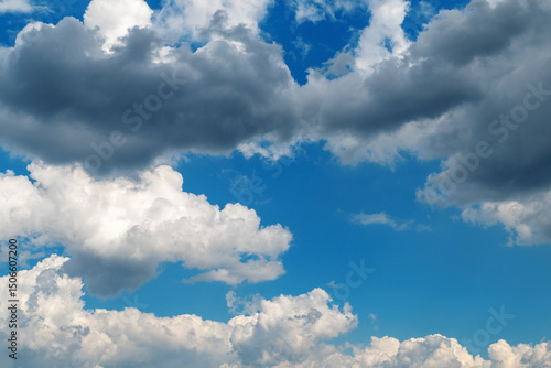Fotografie Dramatic cloudscape with blue sky and vibrant white clouds