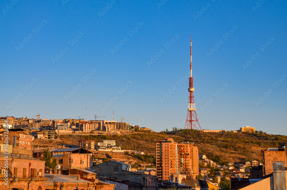 Obraz premium Yerevan TV tower and Nork hill at sunset scenic view from Tumanyan street in Kentron district (Yerevan, Armenia) 