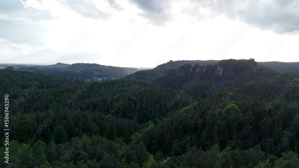 A stunning aerial drone video captures a nature reserve with majestic rock formations and dense forests, revealing the untouched beauty of the wild landscape.
A stunning aerial drone video captures a nature reserve with majestic rock formations and dense forests, revealing the untouched beauty of the wild landscape.