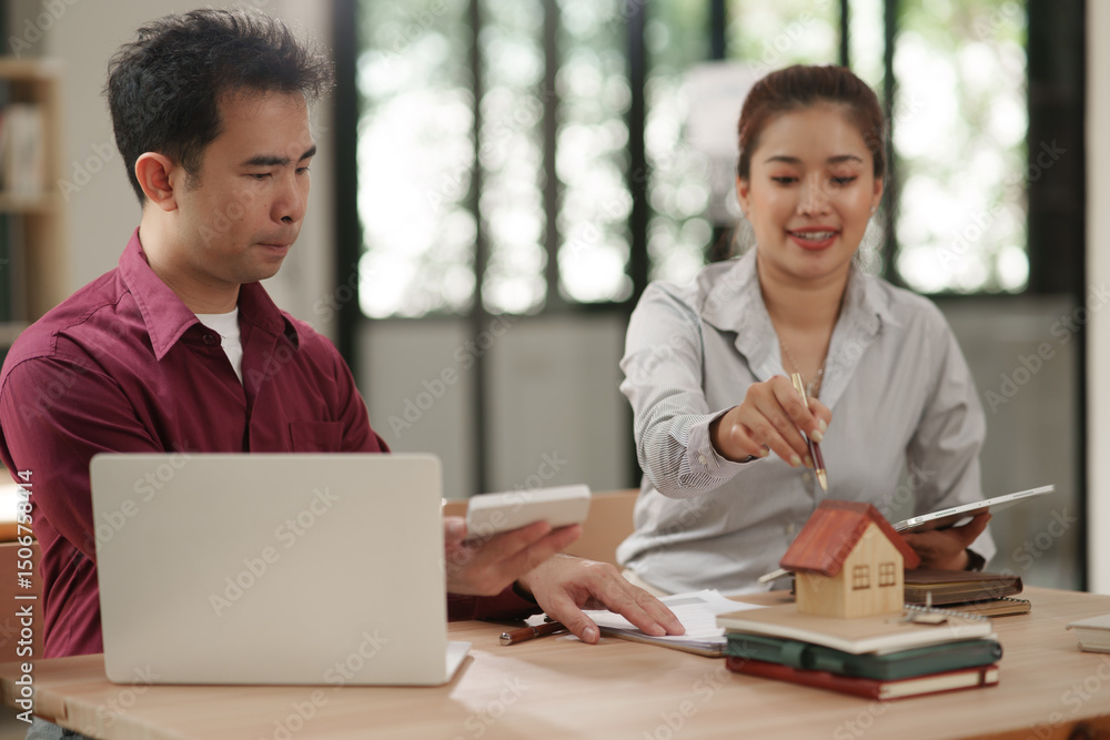 Male and female businessmen apply for a home loan in an office. Male and female businessmen apply for a home loan in an office.
