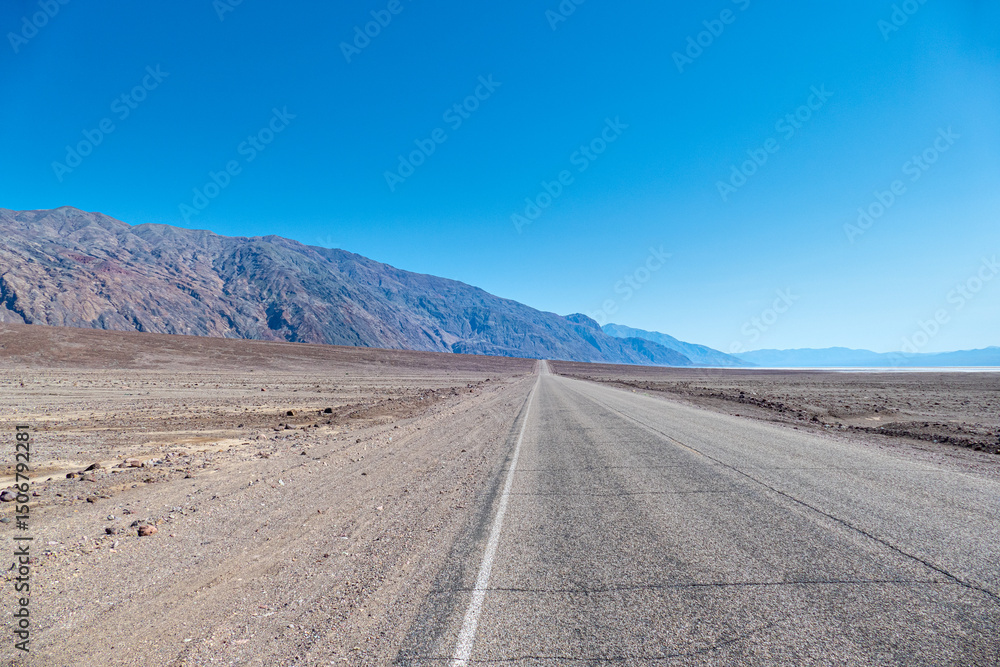 Road in the Death Valley National Park at badwater basin, california USA Road in the Death Valley National Park at badwater basin, california USA
