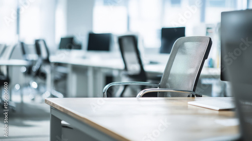 Wallpaper Mural Empty office desk with vacant chairs and computers, symbolizing workforce layoffs and corporate downsizing, representing unemployment and economic challenges in modern workplace. Torontodigital.ca