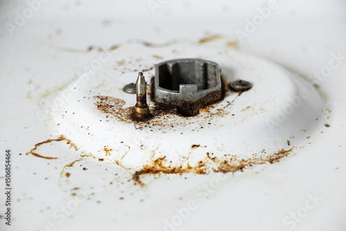 Dirty gas stove surface with grease stains and burn marks