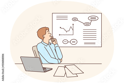 Man corporate manager happily looking at growing charts of increasing profits