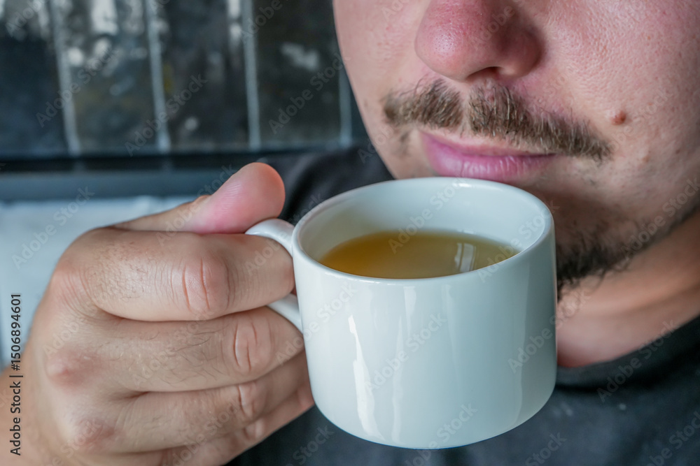 Man Holding White Mug Close to Mouth – Morning Routine and Minimal Lifestyle Man Holding White Mug Close to Mouth – Morning Routine and Minimal Lifestyle