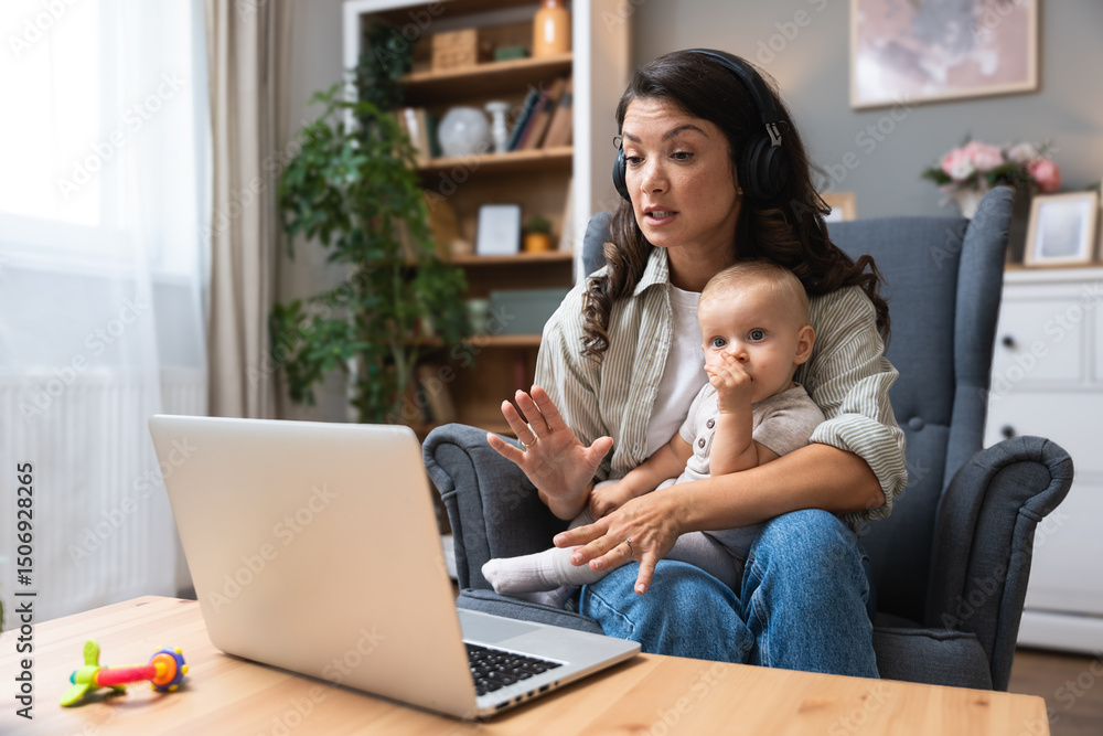 Single mother with baby on lap speaks emotionally via laptop video call to ex-husband about overdue child support, alimony, sitting in armchair wearing wireless headphones, facing financial stress. Single mother with baby on lap speaks emotionally via laptop video call to ex-husband about overdue child support, alimony, sitting in armchair wearing wireless headphones, facing financial stress.