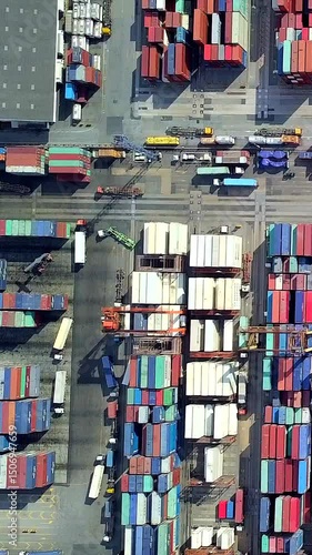 Deep-sea port with container terminals and cargo ships loading and unloading import and export ships