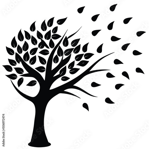 Silhouette of a tree losing leaves in the wind