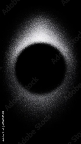 Mysterious circular visualization created using light and particles in a dark environment