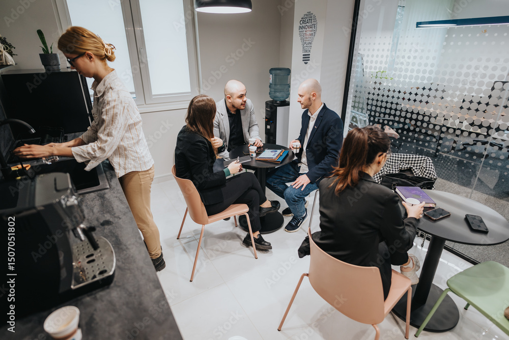 Fototapeta premium Group of colleagues engaging in conversations during a coffee break, highlighting teamwork and collaboration in the workplace.