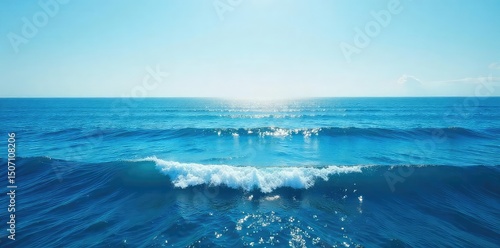 Vast expanse of deep blue ocean water, waves gently rolling under a clear sky, sunlight reflecting on the surface Perfect for travel, nature, or environmental themes , water, texture, ocean