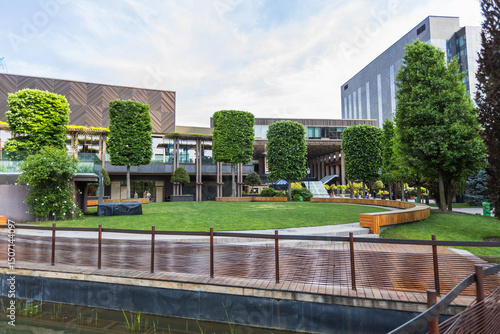 Contemporary Urban Park with Manicured Green Spaces and Modern Business Architecture