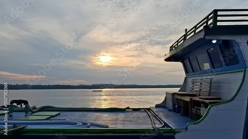 Fishing boats sail back home after fishing. Sunrise background.