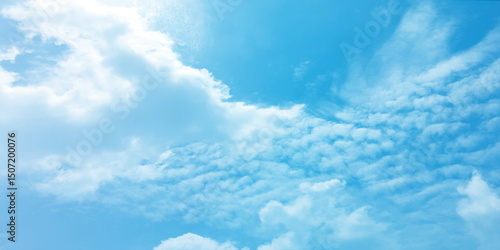 The blue sky and white clouds air indicate pure and fresh, bright weather canvas splashed with  store,m focusing on the clouds, a sunny day 