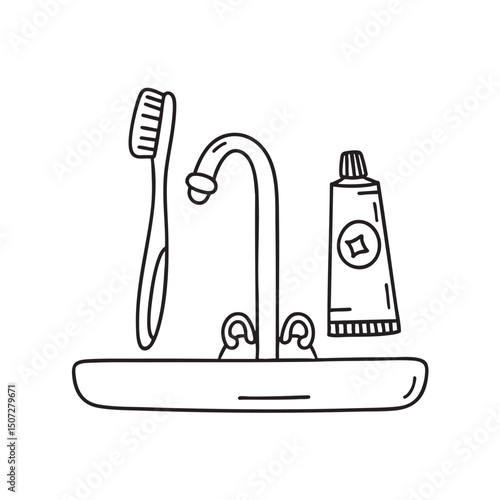 A toothbrush beside a tube of toothpaste on the sink