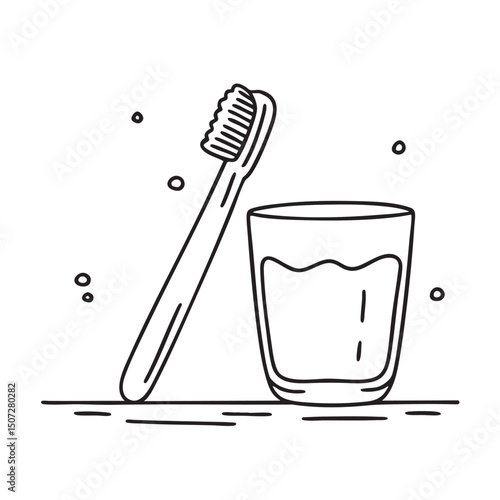 A toothbrush placed near a water glass on a counter